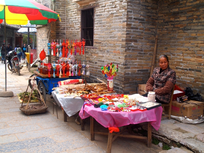 Villager selling goods on Jinma Street