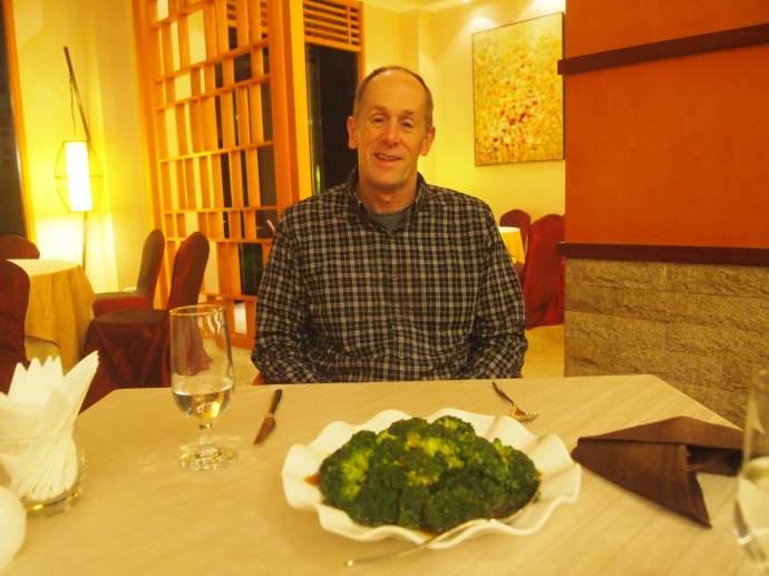 Mike orders steamed broccoli and gets a huge plate of it.