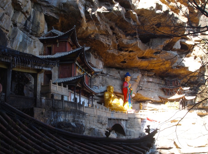 Guanyin and Maitreya, the smiling Buddha, on the cliff ledges at Baoxiang Temple