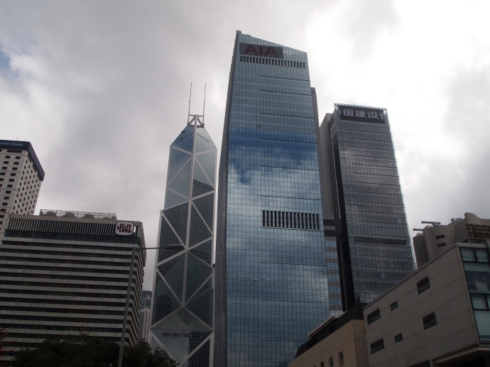 The criss-crossed building is Bank of China