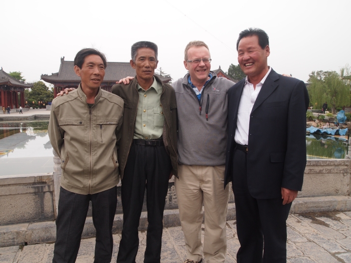 Three Chinese men wanted to pose with Andrew
