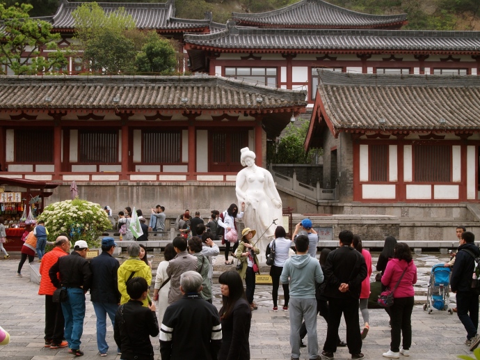 statue of the concubine Yang Guifei, surrounded by Chinese tourists